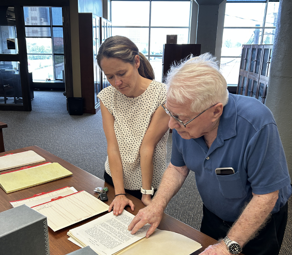 Dr. Cathy Faye working with a donor in the Reading Room